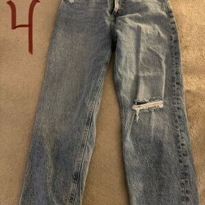 Woman’s Distressed Blue Jeans